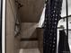 Shower with a bench and a showerhead at 12400 Village Cir, Brighton, CO 80603