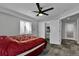 Bedroom with a ceiling fan and closet doors at 12400 Village Cir, Brighton, CO 80603