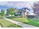 Well maintained single Gathering home with manicured lawn and mature landscaping at 12400 Village Cir, Brighton, CO 80603