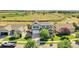 Charming two-story home featuring a well-manicured front yard and a two car garage at 12400 Village Cir, Brighton, CO 80603
