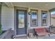 A welcoming front door with decorative glass, a cozy bench, and charming decor at 12400 Village Cir, Brighton, CO 80603