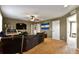 Upstairs living room with a large sectional and a TV at 12400 Village Cir, Brighton, CO 80603