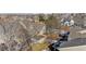 Aerial view of house and surrounding neighborhood, showcasing landscape and location at 6415 Trailhead Rd, Highlands Ranch, CO 80130