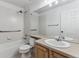 Full bathroom with shower, toilet and double vanity at 6415 Trailhead Rd, Highlands Ranch, CO 80130