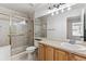 Clean bathroom, with shower/tub combo and double vanity at 6415 Trailhead Rd, Highlands Ranch, CO 80130