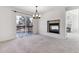 Bright dining room with fireplace and patio access at 6415 Trailhead Rd, Highlands Ranch, CO 80130