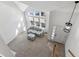 Bright entryway with high ceilings and view of living room and stairs at 6415 Trailhead Rd, Highlands Ranch, CO 80130