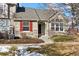 Attractive exterior of a two-story home with red shutters and stone accents at 6415 Trailhead Rd, Highlands Ranch, CO 80130