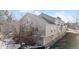 Rear exterior view of the home, showcasing the deck and surrounding neighborhood at 6415 Trailhead Rd, Highlands Ranch, CO 80130