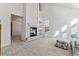 Spacious living room featuring a fireplace and large windows at 6415 Trailhead Rd, Highlands Ranch, CO 80130