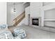 Living room with fireplace, high ceilings, and stairs at 6415 Trailhead Rd, Highlands Ranch, CO 80130