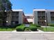 Attractive condo building featuring multiple units with balconies, landscaped grounds, and convenient parking at 14740 E Kentucky Dr # 725, Aurora, CO 80012