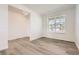 Bright and airy bedroom with wood floors and a large window for natural light at 627 Nightsky St, Erie, CO 80516
