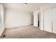 Bedroom featuring neutral carpet and a double closet at 627 Nightsky St, Erie, CO 80516