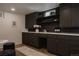 Finished basement bar area with custom cabinetry, perfect for entertaining at 768 W Larigo Ave, Littleton, CO 80120