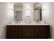 Elegant bathroom featuring a dual sink vanity with bronze fixtures and contemporary lighting at 768 W Larigo Ave, Littleton, CO 80120