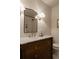 Bathroom vanity features marble countertop, elegant fixtures, and a vintage design at 768 W Larigo Ave, Littleton, CO 80120