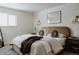 Bright bedroom features a comfortable bed, soothing colors, and stylish decor at 768 W Larigo Ave, Littleton, CO 80120