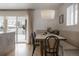 Breakfast nook with padded seating, stylish lighting, and sliding glass doors at 768 W Larigo Ave, Littleton, CO 80120