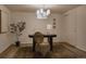 Bright office featuring a statement light fixture, warm lighting, and a decorative plant at 768 W Larigo Ave, Littleton, CO 80120