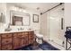 Modern bathroom with wood vanity, sleek glass shower, and stylish fixtures, offering a spa-like experience at 7440 W 94Th Pl, Westminster, CO 80021