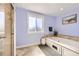 Bathroom featuring a soaking tub with tile surround and a large window at 7440 W 94Th Pl, Westminster, CO 80021