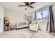 Bedroom with a white crib, glider chair, and a large window overlooking the neighborhood at 7440 W 94Th Pl, Westminster, CO 80021