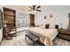 Bright bedroom with a built-in desk and shelving, and a ceiling fan at 7440 W 94Th Pl, Westminster, CO 80021