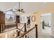 Bright hallway with large window, built-in shelving, and views into other living spaces at 7440 W 94Th Pl, Westminster, CO 80021