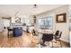 Open kitchen and breakfast nook area features hardwood floors and stainless steel appliances at 7440 W 94Th Pl, Westminster, CO 80021