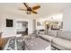 Cozy living room with a large sectional sofa, ottoman, and decorative rug at 7440 W 94Th Pl, Westminster, CO 80021