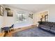 Bright and cozy living room features hardwood floors and large window, creating a welcoming atmosphere at 7440 W 94Th Pl, Westminster, CO 80021