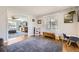 Bright and airy living room features hardwood floors and large window, creating a welcoming atmosphere at 7440 W 94Th Pl, Westminster, CO 80021