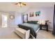 Spacious main bedroom with vaulted ceilings, two large windows and comfortable furniture at 7440 W 94Th Pl, Westminster, CO 80021