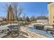 Outdoor patio with comfortable seating, dining area, and fire pit, perfect for outdoor entertaining at 7440 W 94Th Pl, Westminster, CO 80021