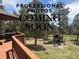 Well-maintained backyard showcasing outdoor living space, barbeque grill, and a play area at 29266 S Sunset Trl, Conifer, CO 80433