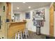 Stylish basement bar with wood accents, comfortable seating, and a display of medals, perfect for entertaining at 29266 S Sunset Trl, Conifer, CO 80433