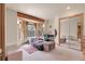 Cozy bedroom with a bay window, a study area, and mirrored closet doors, offering comfort and functionality at 29266 S Sunset Trl, Conifer, CO 80433