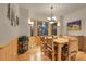 Rustic dining room featuring wood furnishings, wainscoting, and a nature-inspired decor at 29266 S Sunset Trl, Conifer, CO 80433