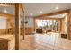 Spacious living area with natural light, wood accents, and scenic outdoor views at 29266 S Sunset Trl, Conifer, CO 80433