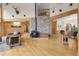 Inviting living room with a stone fireplace, wood accents, and open floor plan at 29266 S Sunset Trl, Conifer, CO 80433