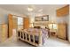 Relaxing bedroom with wood accents, warm lighting, and mountain-themed decor at 29266 S Sunset Trl, Conifer, CO 80433