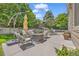 A lovely back patio is set up with comfortable furniture, an umbrella, and a table with chairs at 2938 S Zeno Way, Aurora, CO 80013