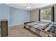 Bedroom featuring a bed and a window at 2938 S Zeno Way, Aurora, CO 80013