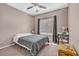 Cozy bedroom with natural light, ceiling fan, carpet, and a comfortable bed for relaxation at 2938 S Zeno Way, Aurora, CO 80013