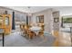 Formal dining area featuring a large table, elegant chandelier, and ample natural light at 2938 S Zeno Way, Aurora, CO 80013