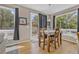 Bright dining area with natural light, wood floors, backyard access, and seating for four at 2938 S Zeno Way, Aurora, CO 80013