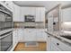 Well-equipped kitchen with stainless steel appliances, white cabinets, and granite countertops at 2938 S Zeno Way, Aurora, CO 80013
