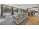 Inviting living room with large windows and an open concept design to the kitchen at 2938 S Zeno Way, Aurora, CO 80013