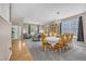 Spacious living area with a dining table, large windows, and a seamless flow for entertaining at 2938 S Zeno Way, Aurora, CO 80013